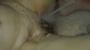 Ample brunette hoe gets her pussy stimulated with stream of cold water