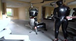 Masked redhead in latex gets tied up