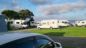 Filthy Kiwi mature MILF pisses on the ground at the campground while campers are around