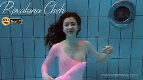 Roxalana Cheh wearing pink dress in the pool