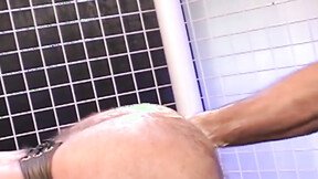 Hunky homosexual in his jockstrap endures having his booty fist banged by his budd