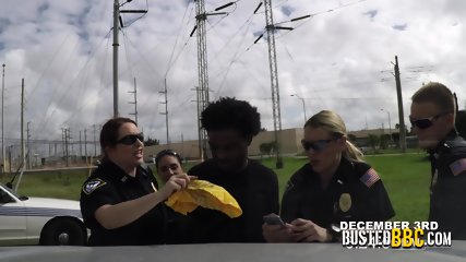 Perverted milf cops chase peeping tom through a field