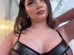 Busty babe playing with her big boobs