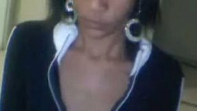 Dark skinned Latina webcam chick changes her clothes flashing her tits