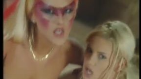 two stunning blondes in crazy makeup share a huge cock