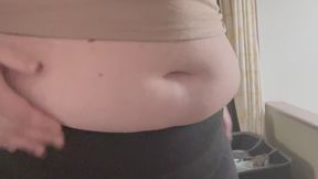 Trying on old, stretched out shorts over my expanding, stretched out belly