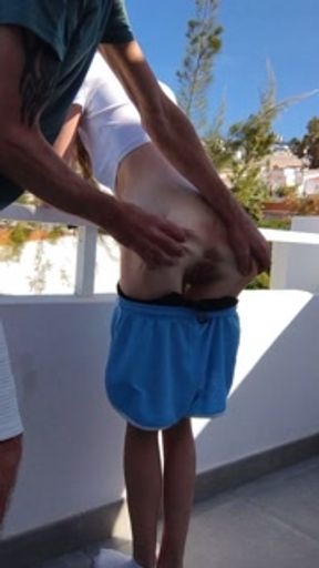 Petite gorgeous bum gets spanked over balcony in tenerife