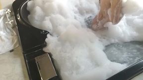 brunette washes her big tits in hydromassage
