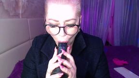 a cool busty vulgar mature whore in glasses with a ponytail on her head...