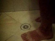 Soapy shower feet and rubbing one down - peephole view