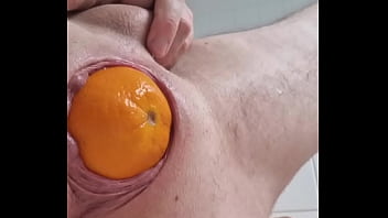 Eggplant and slow motion orange birthing