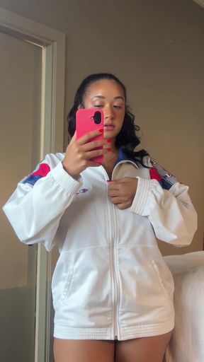 Female athlete in white jacket