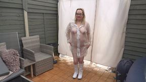 Naked wearing Plastic Transparent Raincoat and White PVC Boots in the freezing Cold outdoors