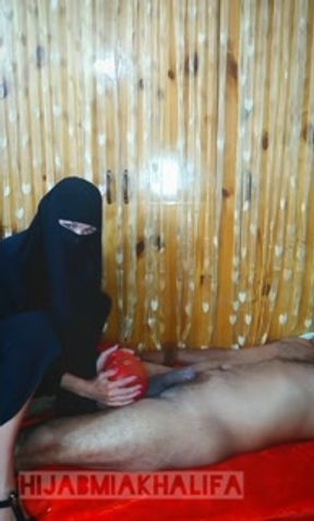 Muslim mistress in Black Hijab bursts a balloon on dick by high heels