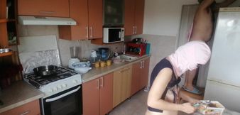 Crazy couple having fun in the kitchen.