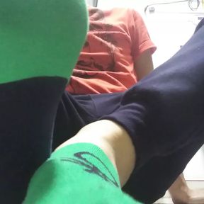 Green sweaty socks and dirty feet after work