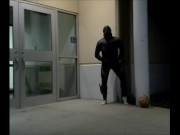barefoot frogman cums inside a condom in front of hotel doors