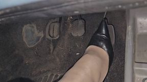 Pedal pumping and driving Fiat Panda in black hig heels décolleté