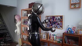 Girl In Latex And Metal And Chastity Belt With Vibrator