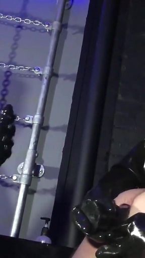 Lady Valeska and Miss Patricia have their sub over a bench.