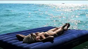 I watched on the beach how a naked girl with big tits was sunbathing on a mattress. Slow motion