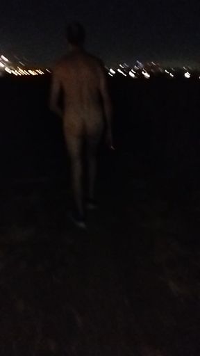 Naked walking on the hill along highway