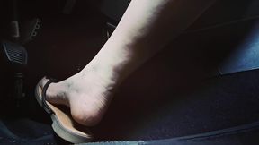 adorable pedal pumping in flip flops and bare feet