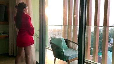 Voluptuous brunette Vina Moon pleasures her redheaded lover on the balcony at sunset