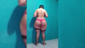 White shemale revealing her huge butt while wearing lingerie.