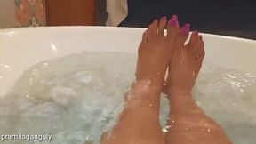 Wet Beautiful Barefeet In Bathtub With Pink Long Toenails