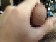 Watch a hairy Japanese man masturbate while squeezing his uncircumcised penis.