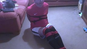 Miss M with a footballer bound and gagged tight and squirming on floor