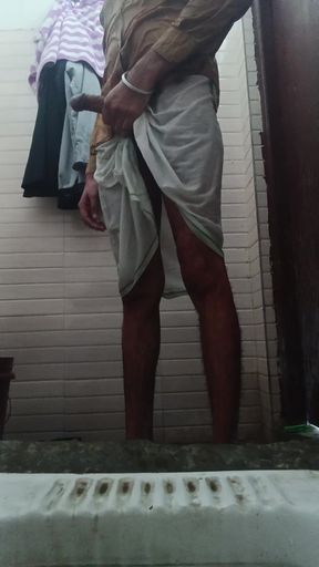 The boy of the village took out the thick penis from inside the lungi and took out the semen