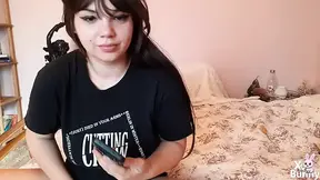 Amateur girlfriend plays with her juicy pussy while watching porn on her phone