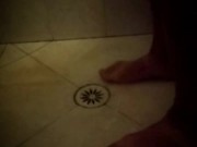 Soapy shower feet and rubbing one down - peephole view
