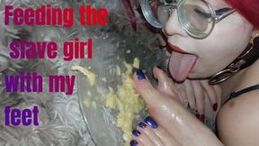 Feeding the slave girl with the queen's feet