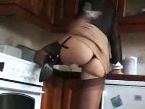 Lusty blonde mature wife Sara shows off her goodies in kitchen