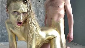 pretty woman makes herself a golden body art, then gently fucks and sucks a dick, filled the whole body art with sperm