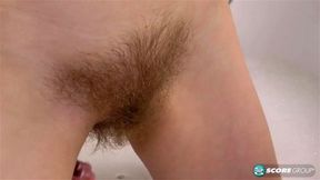 Bush Baby Alexa combs her blonde pussy hair in a warm, soapy bath