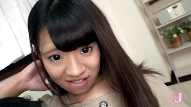 Young Japanese woman fingers herself on the couch as he touches her breast