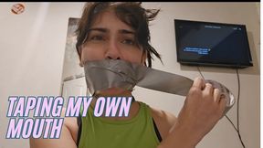 Taping my own mouth with grey tape