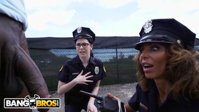 Two white cop chicks detain a black guy to enjoy his dick