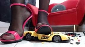 crushing the yellow Lamborghini RC toycar in nylons and different heels and sandals