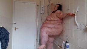 Ssbbw body covered in chocolate sauce in shower