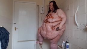 Ssbbw body covered in chocolate sauce in shower