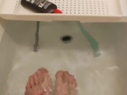skinny twig strokes his cock and pissed in sink and shows off feet in bathtub