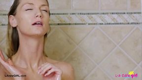 Captivating fair-haired model took a shower