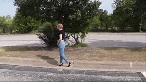 Walking Outdoors in Jeans and Black Sandals