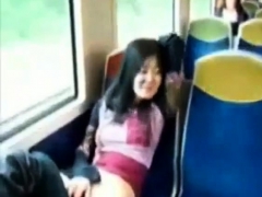 Asian milf rubs her clit on a train.