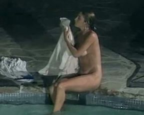 Marvelous and sensual hottie with big breasts swims in the pool